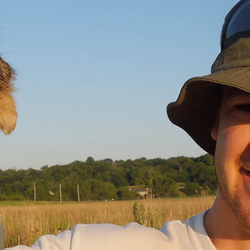 a man holding a small animal